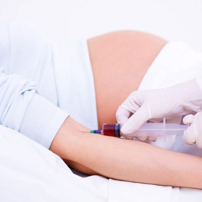 Doctor takes a screening test from a pregnant woman
