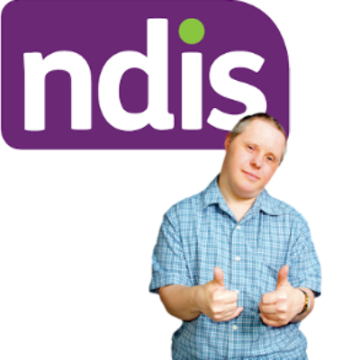 A man in a blue shirt in front of an NDIS sign
