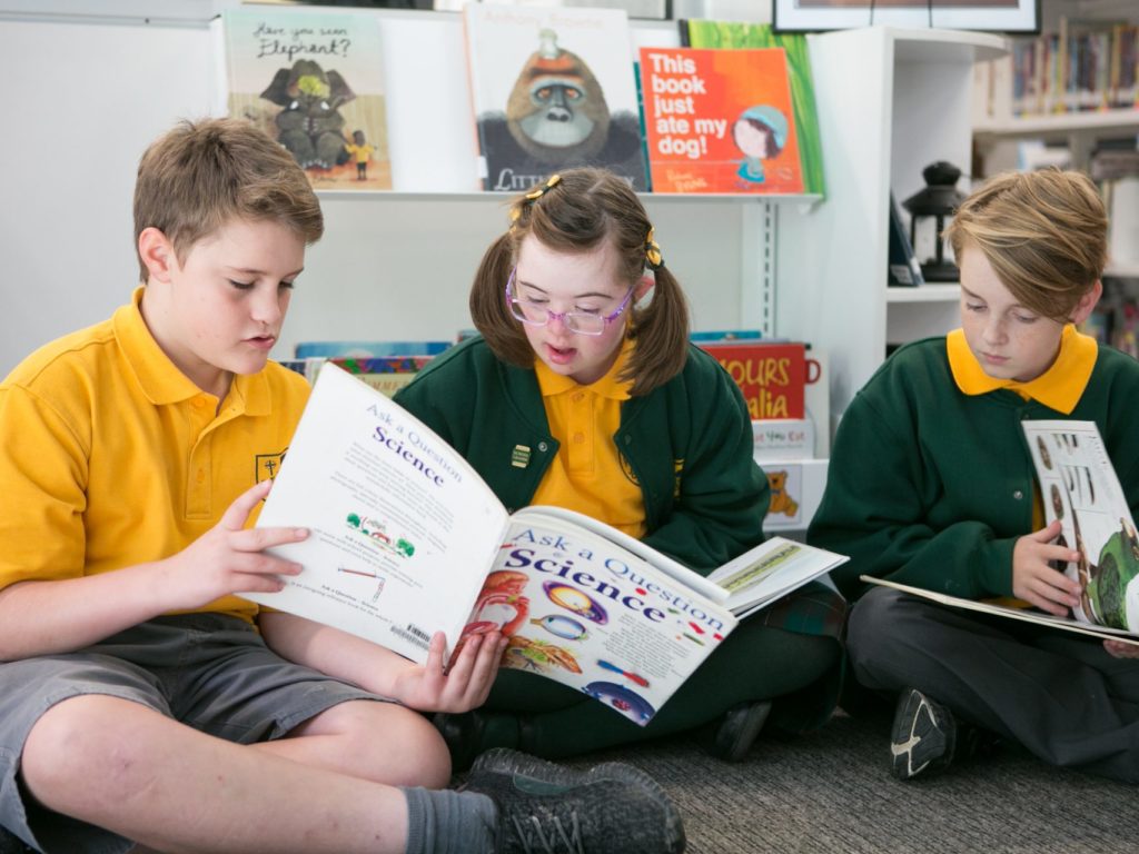 Children reading science books.