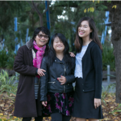 Women stand together smiling