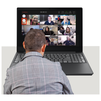 A man looks at an online meeting on a computer