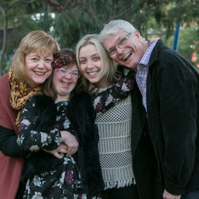 A family standing together and smiling