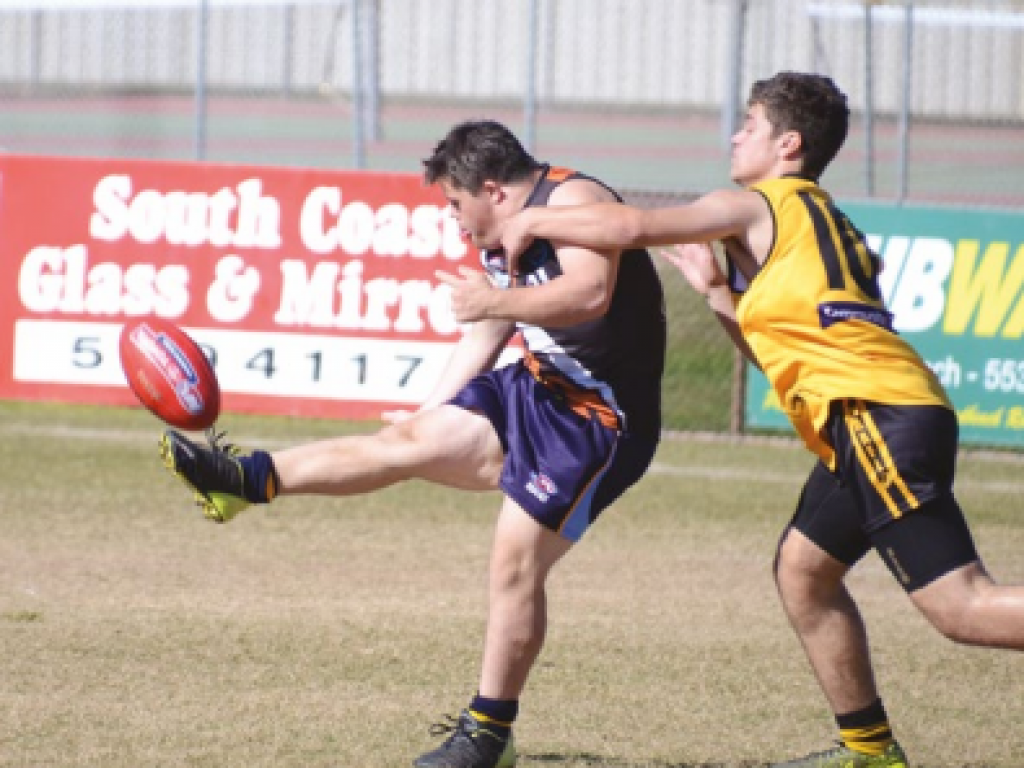 Man kicking a football