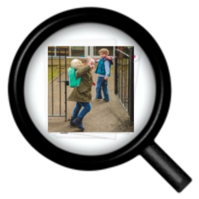 A magnifying glass over a picture of children at school