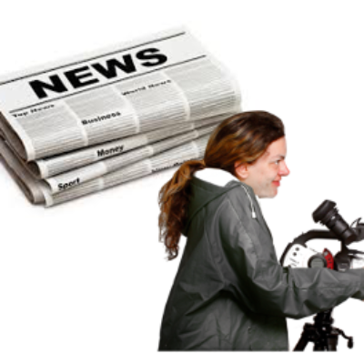 A person stands at a microphone and a picture of a newspaper